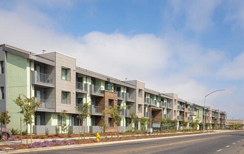 The Residences at Depot Street development sit against a bright, sunny sky. 