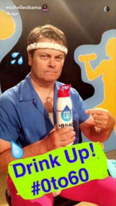 Nick Offerman points to the water bottle that he is holding. The caption reads #0to60