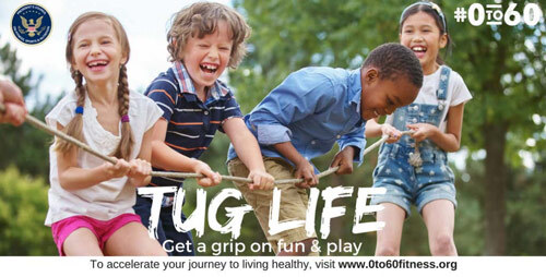 4 children smiling and tugging on a rope. The caption reads Tug life