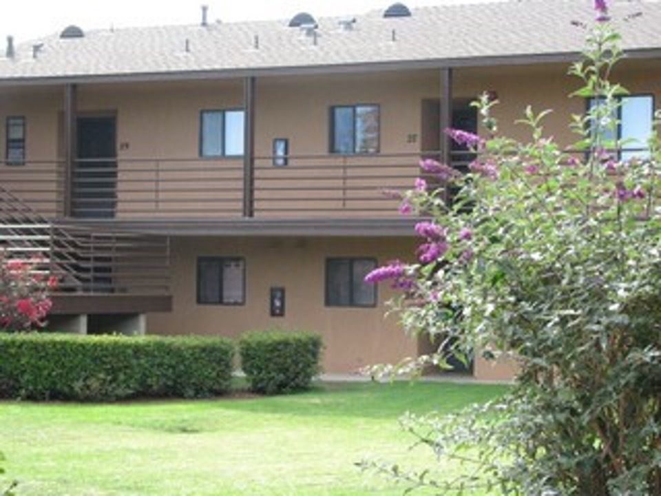 Parkside Garden apartments surrounded by beautiful landscaping and grass